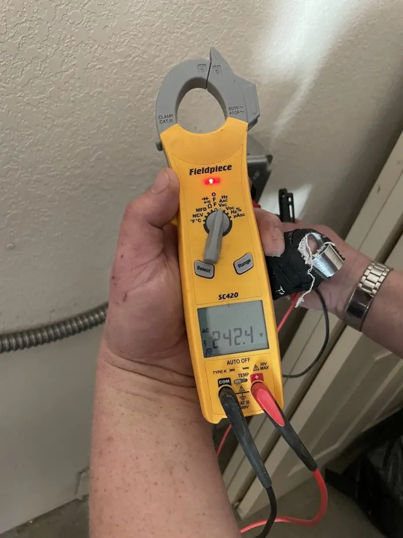 Voltage testing with clamp meter during Ceiling Fan Installation in Carencro